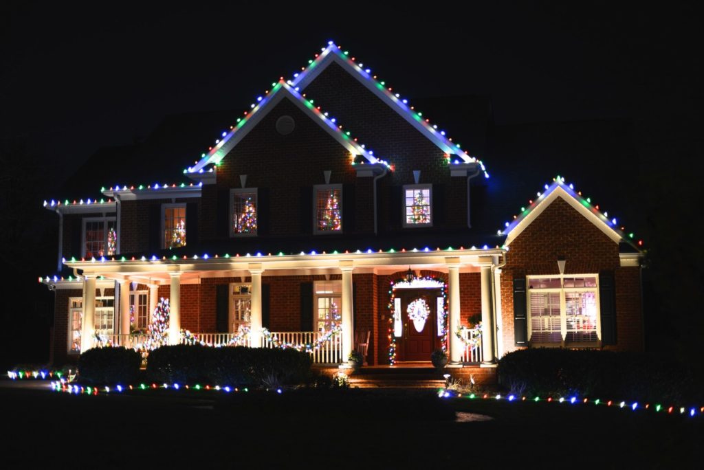 A house surrounded by colorful Christmas lights is located in Lakeville.