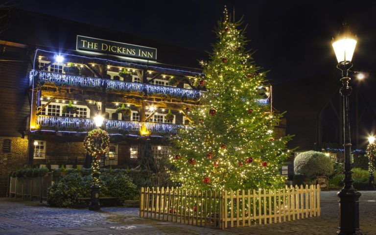 A big Christmas tree in front of The Dickens Inn located in Lakeville.